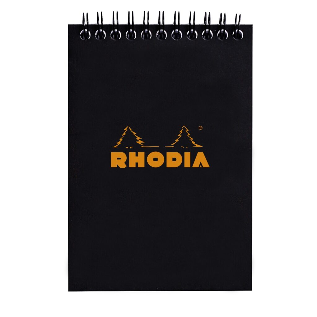 Produktfoto zum Notepad mit Doppelspirale von Rhodia in der Produkt Variante schwarz in dem Produkt Format DINA6 in der Produkt Lineatur kariert in der Produkt Breite 80 g / Product photo for Notepad with double spiral from rhodia in product variant schwar