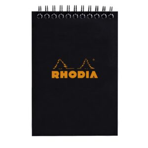 Produktfoto zum Notepad mit Doppelspirale von Rhodia in der Produkt Variante schwarz in dem Produkt Format DINA6 in der Produkt Lineatur kariert in der Produkt Breite 80 g / Product photo for Notepad with double spiral from rhodia in product variant schwar